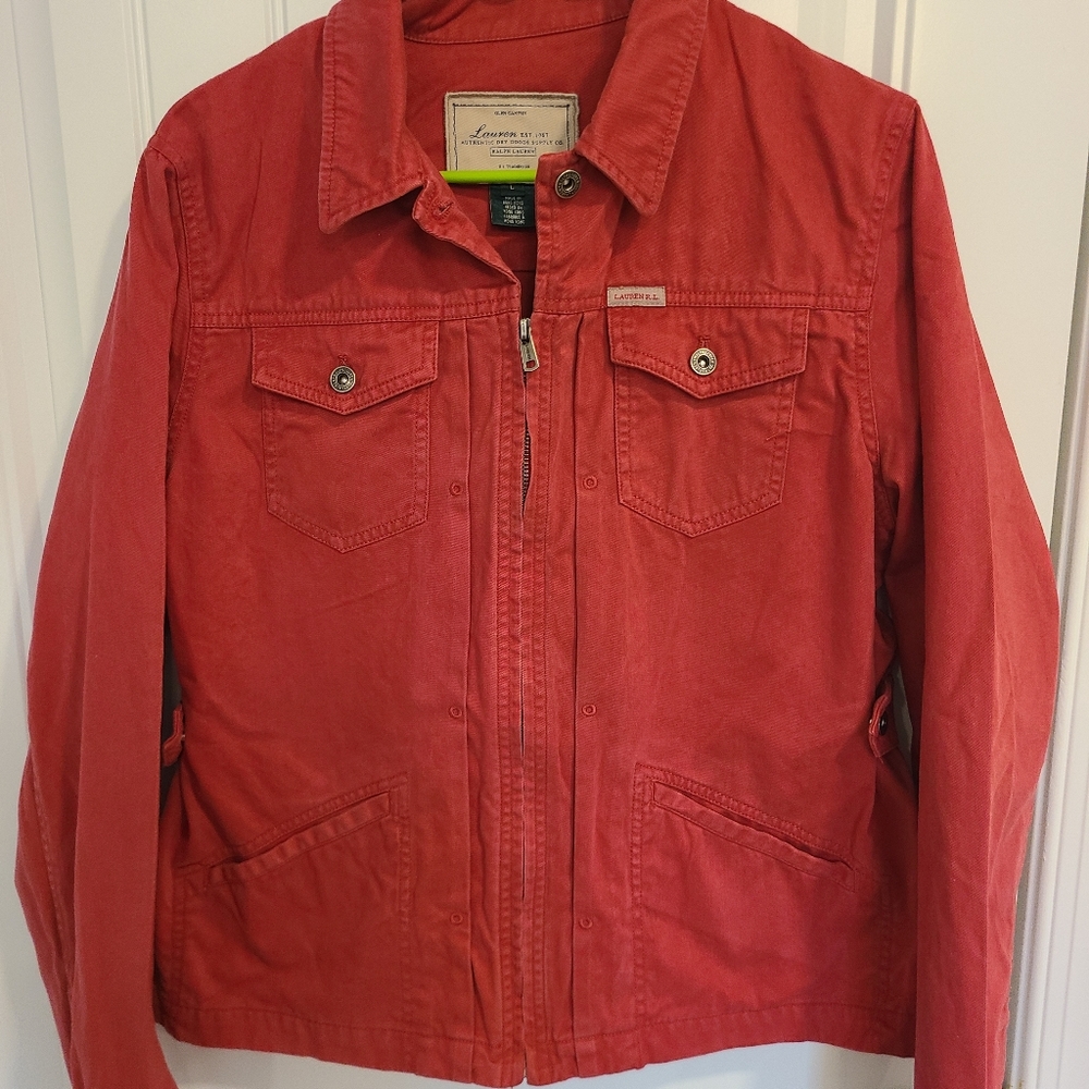 Zip up coat, button adjustments on sides to make a more tailored fit